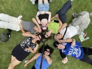 A few of us laying in a circle in the grass.