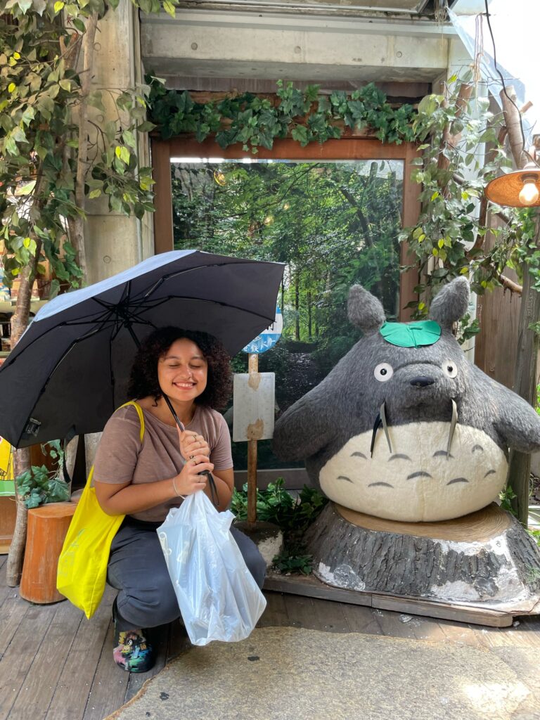 Oli posing next to Totoro