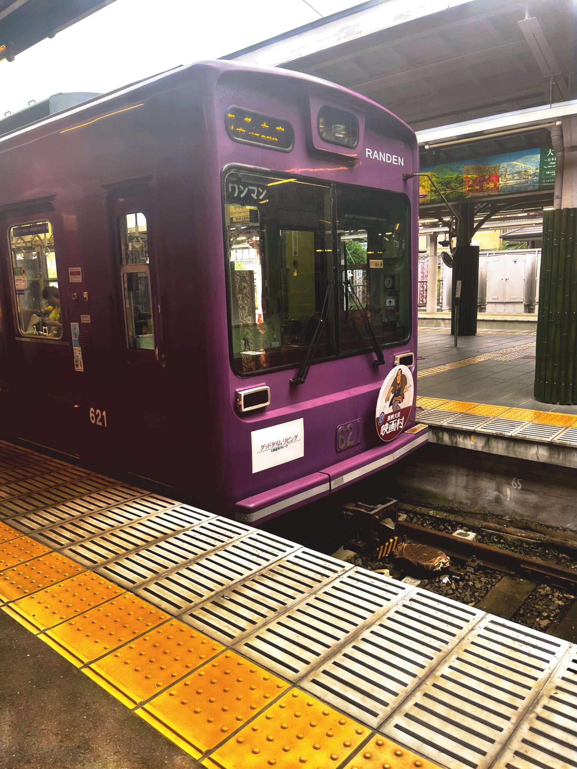 A trolley pulling up to Arashiyama Station.