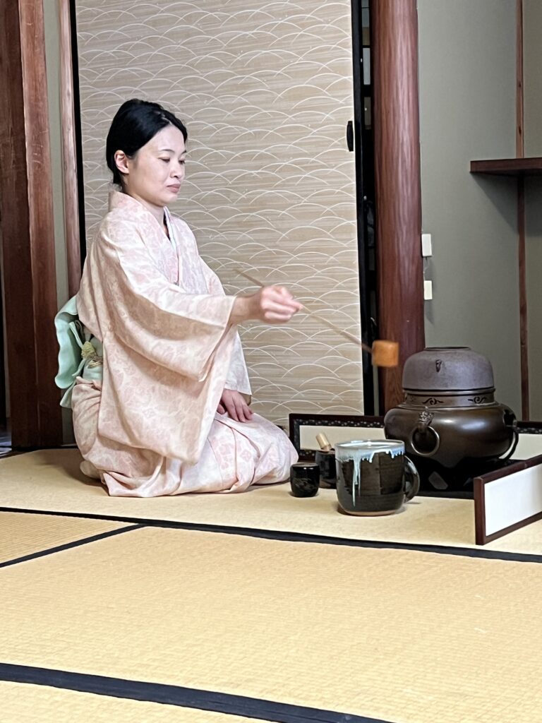 A tea master serves match at a traditional Japanese tea ceremony in Kyoto.