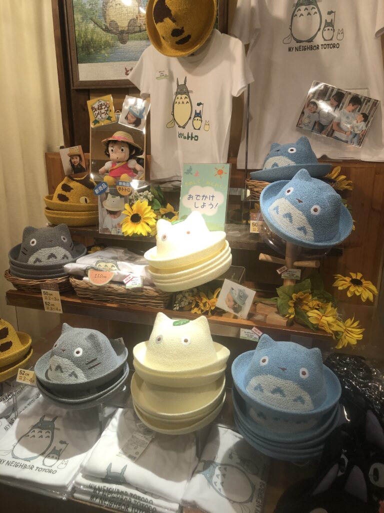 Display of hats shaped like Totoro cats 